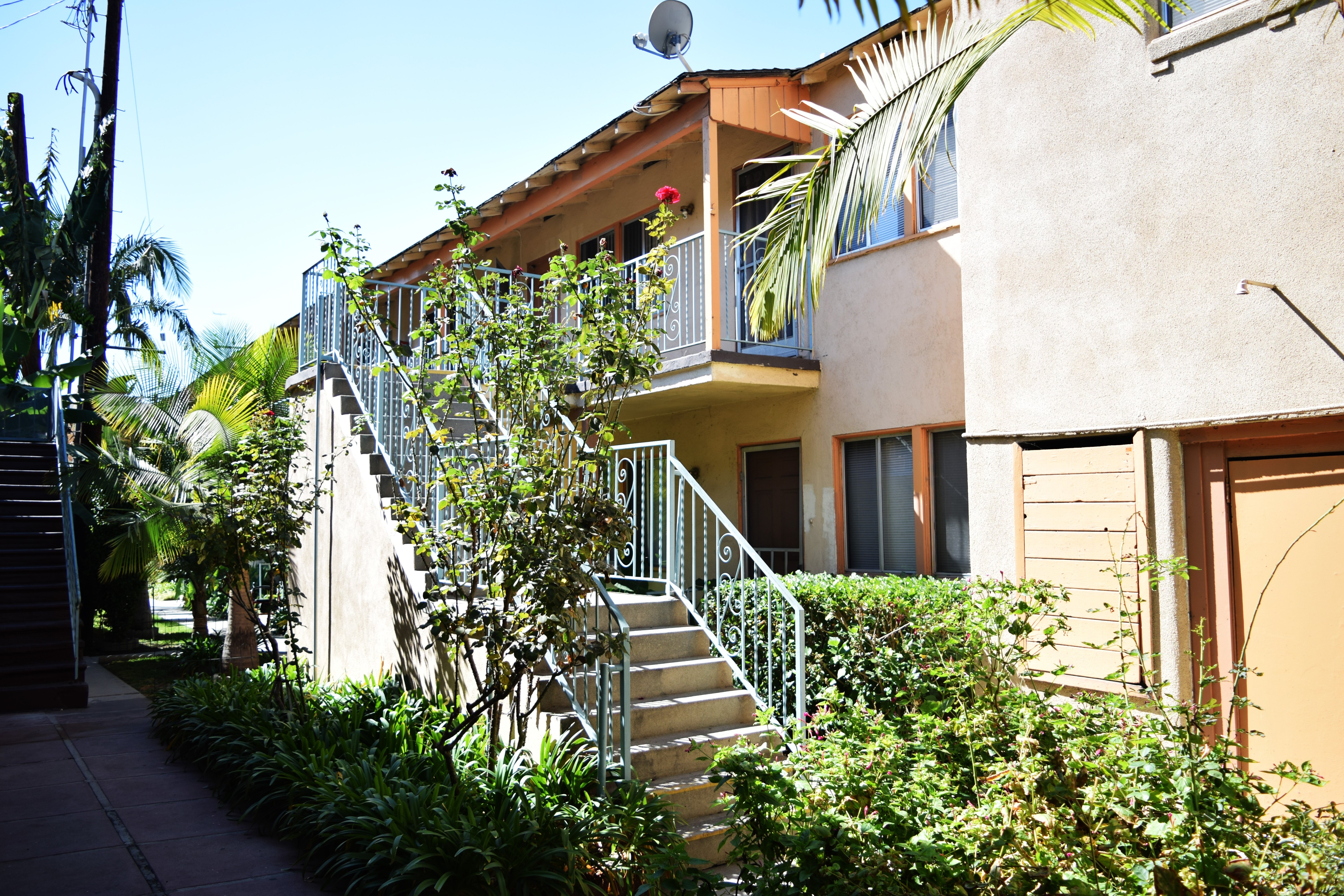 A building with a staircase and a balcony.